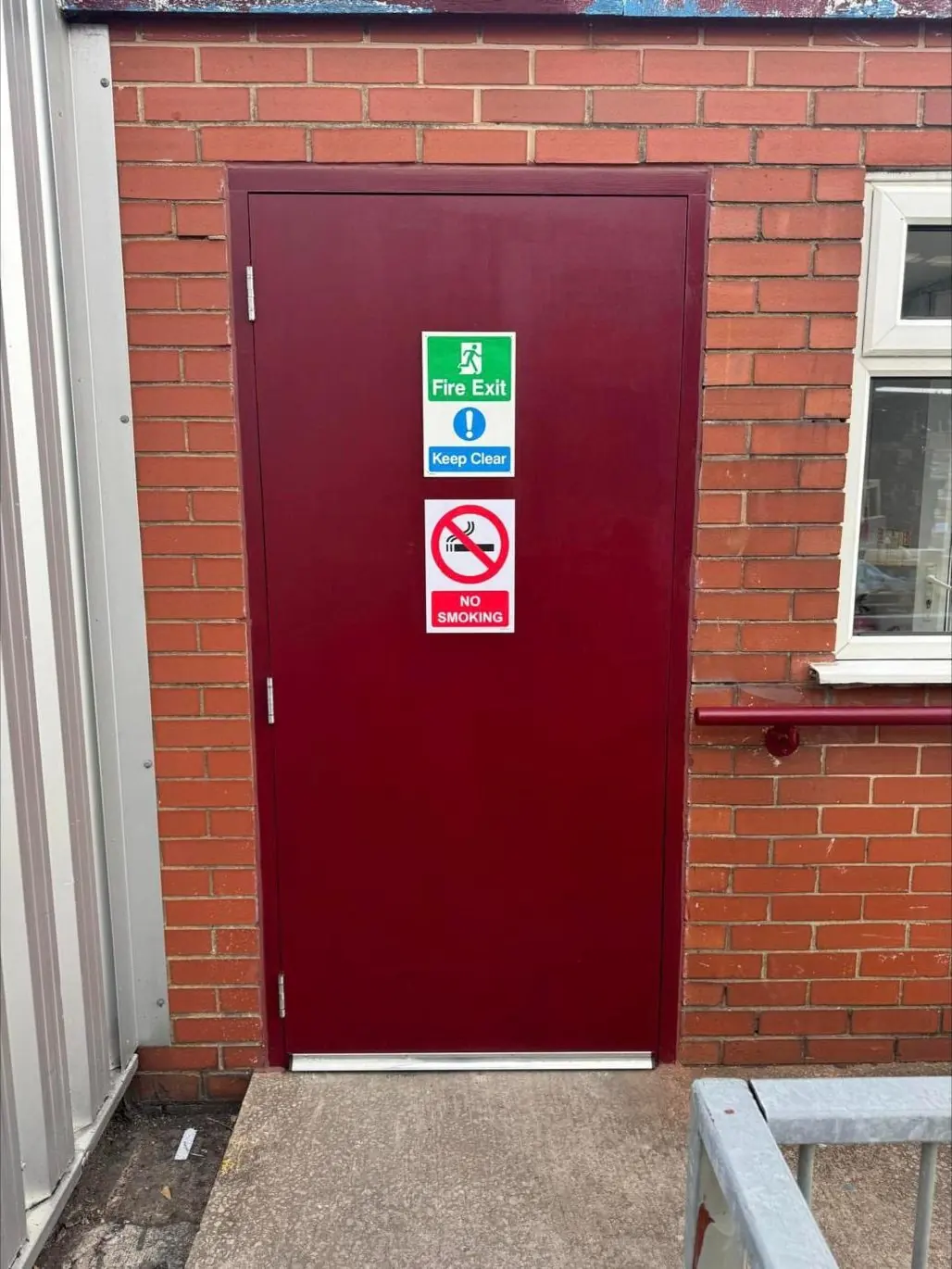 External fire exit door and frame with signage