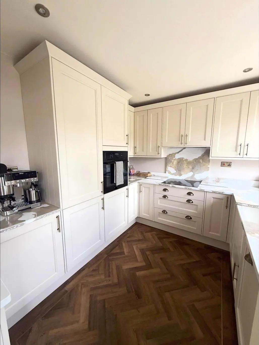 Cream shaker kitchen with herringbone floor