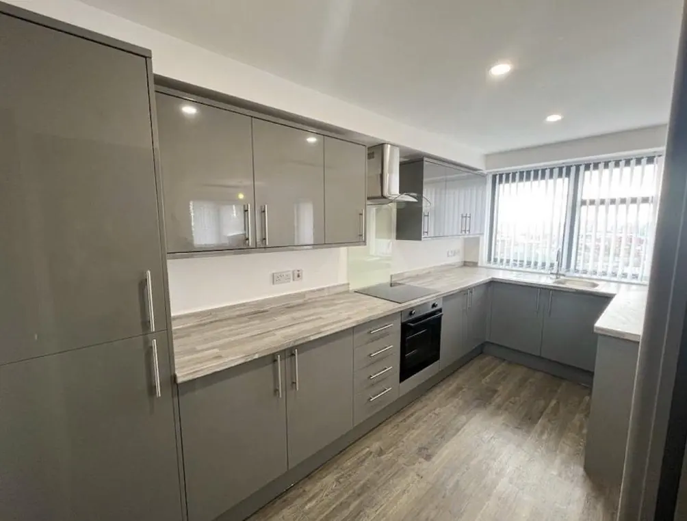 Grey gloss kitchen in a new-build apartment