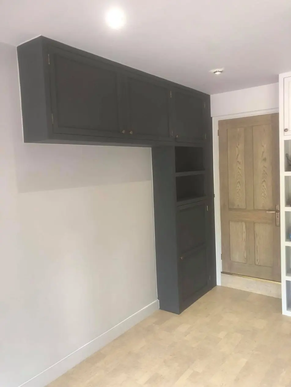 Fitted grey wall units in a converted garage