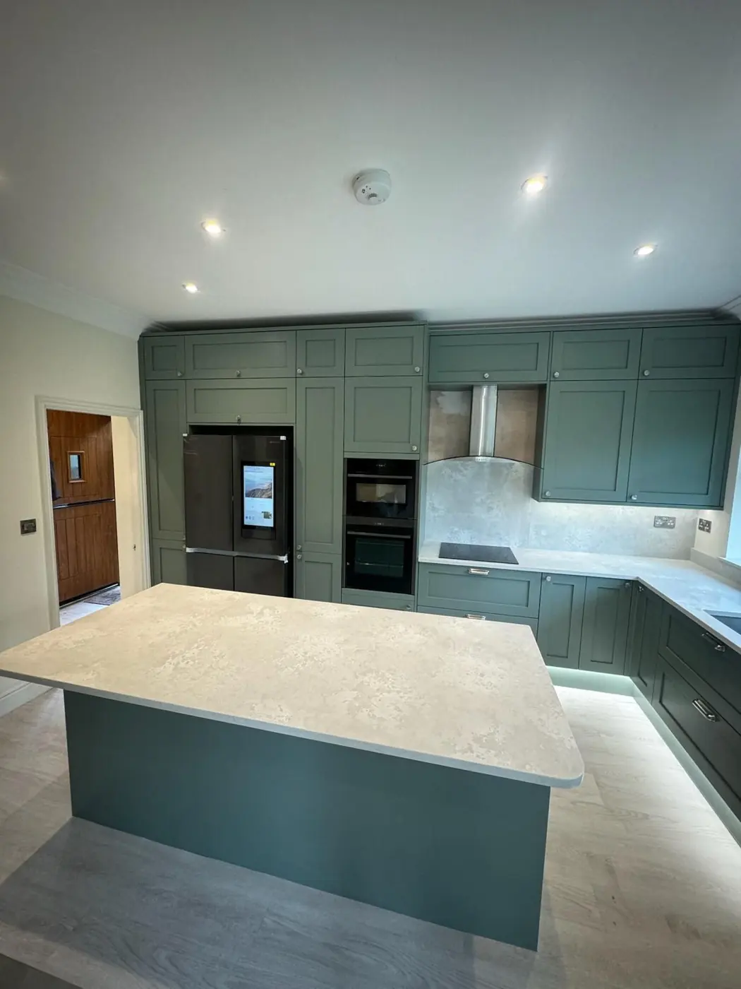 Sage green shaker kitchen with island