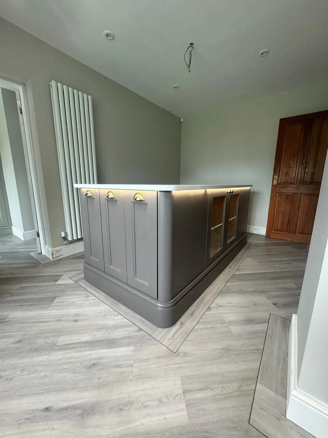 Grey shaker island with curved end panels