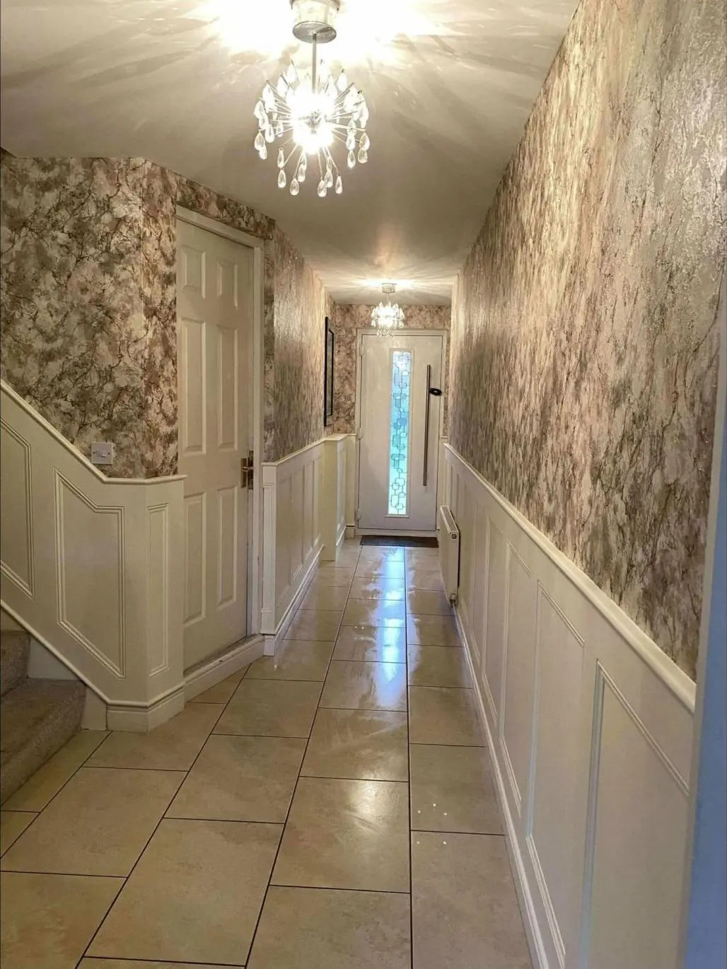 Hallway with wall panelling and staircase panelling
